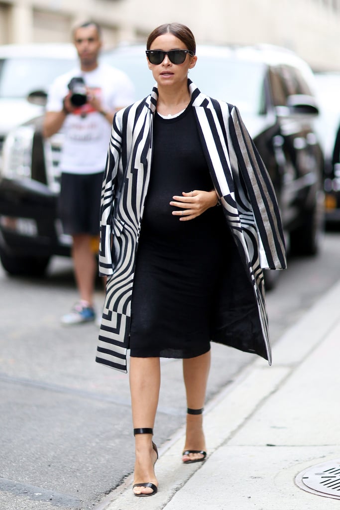 There's nothing that looks quite as good with a black dress as a bold, black-and-white graphic coat.