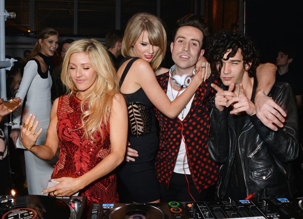 Taylor continued to hug Nick as Ellie took over DJ duties and Karlie watched the whole scene from across the room.