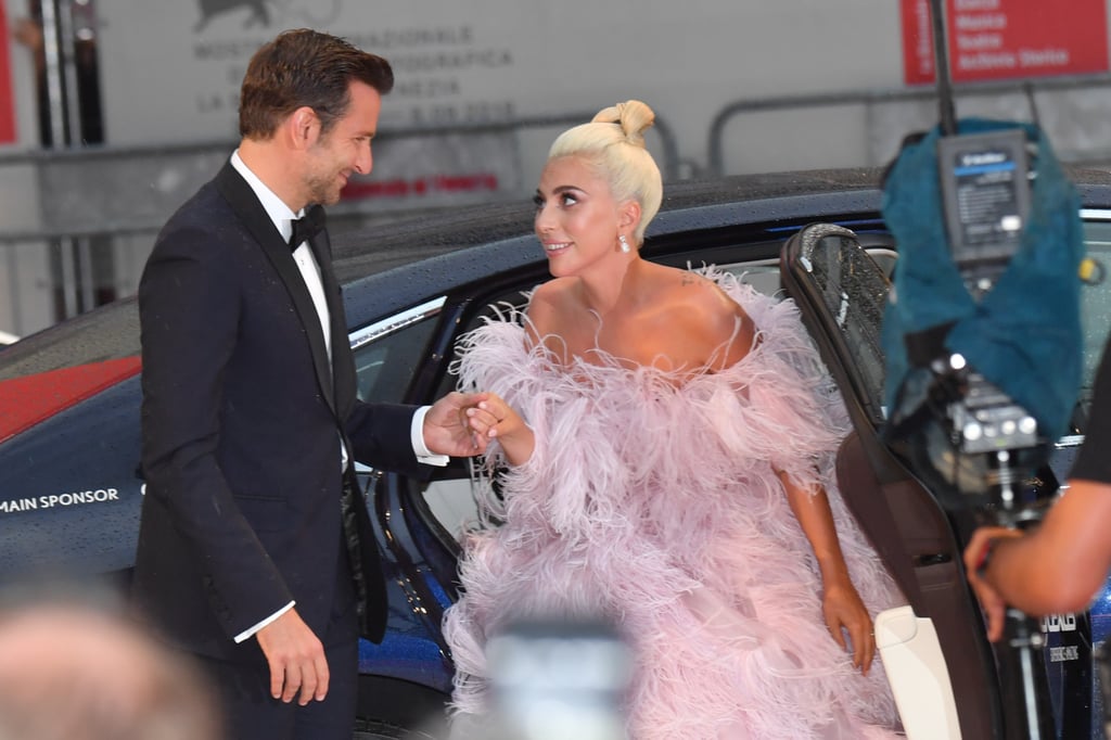 For the red carpet premiere of A Star Is Born in Venice, Bradley showed off his chivalry by helping Gaga out of her car.