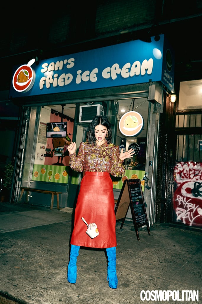 Lucy wearing a Gucci top, skirt, and boots with Jennifer Fisher earrings and a Sylvia Toledano ring.