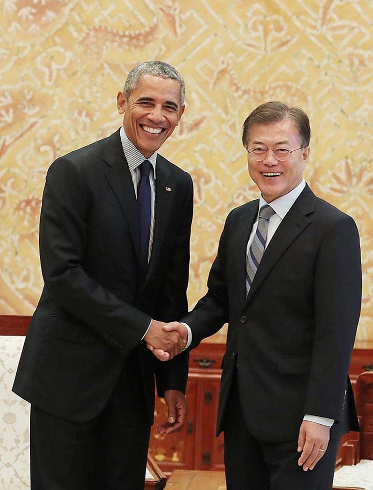 Here he is shaking hands with South Korean president Moon Jae-in in Seoul.