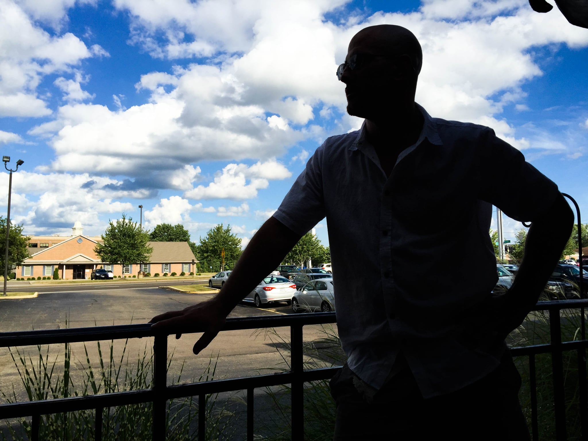 *Andrew, 37, looks out from the patio at a restaurant in Canton, Ohio on Aug. 18. (Photo by Stephanie Haney)