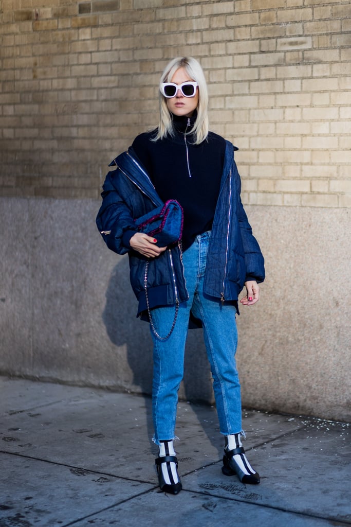 Linda Tol proved if you have an interesting navy puffer coat (worn off the shoulder), the rest of your outfit will look equally cool.
