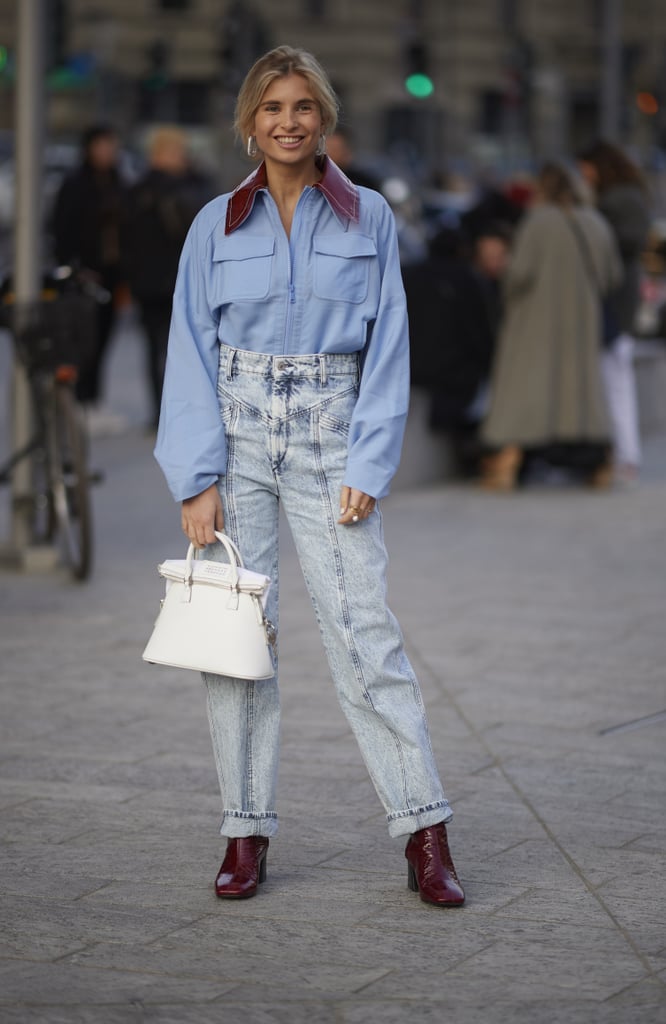 Tuck a boxy zip-up into mom jeans and finish with your favorite boots