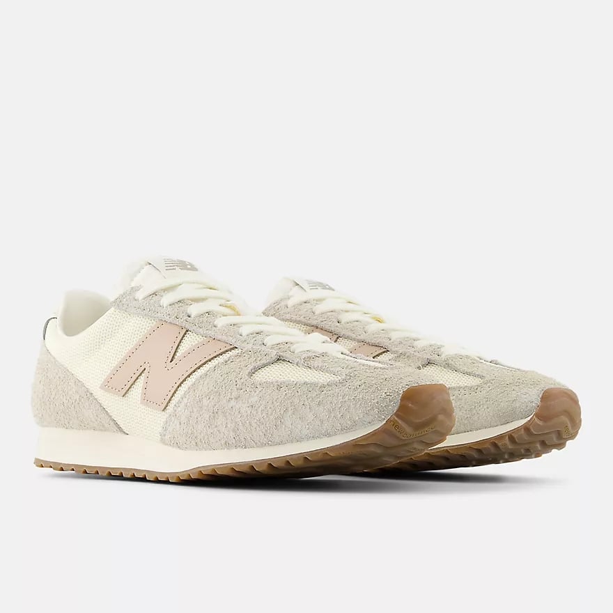 New Balance 471 Sneakers ($110)
Inspired by '70s running shoes, the latest New Balance design adds a vintage feel to any outfit. The strategic blocking of different fabrics throughout makes this sneaker the perfect fit for a casual office look or any occasion where you want a step up from a gym style. Plus, the breathable mesh will keep you feeling comfy all day long.