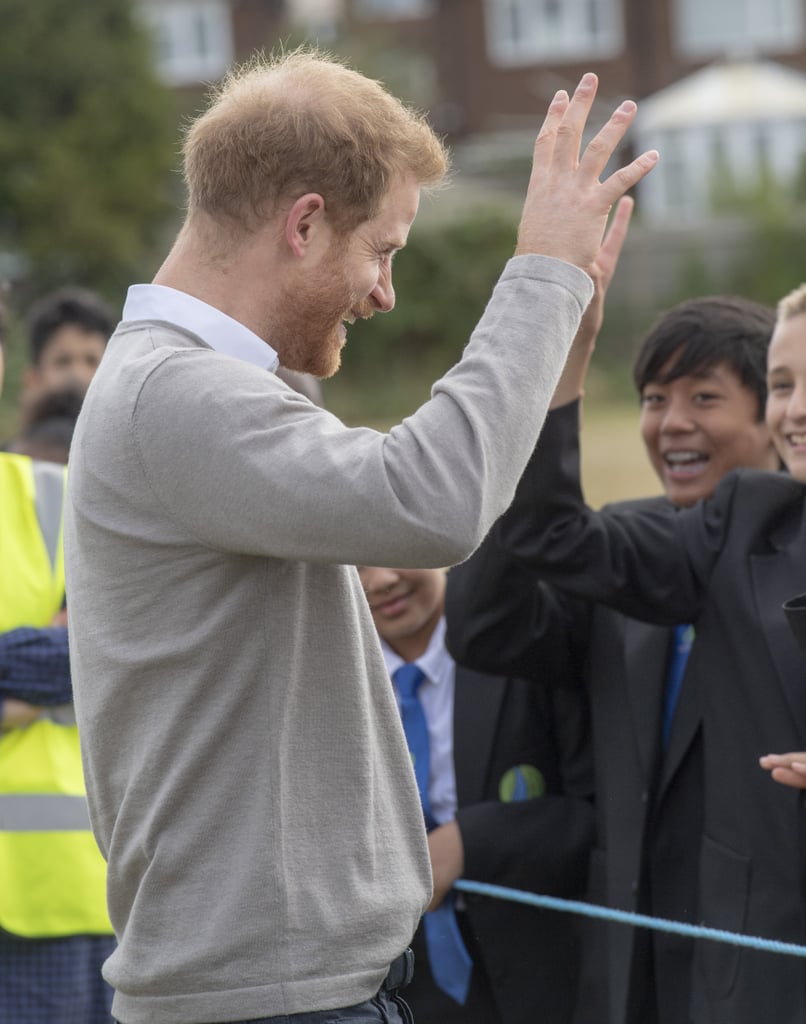 Prince Harry Hugs Kids at Lealands High School