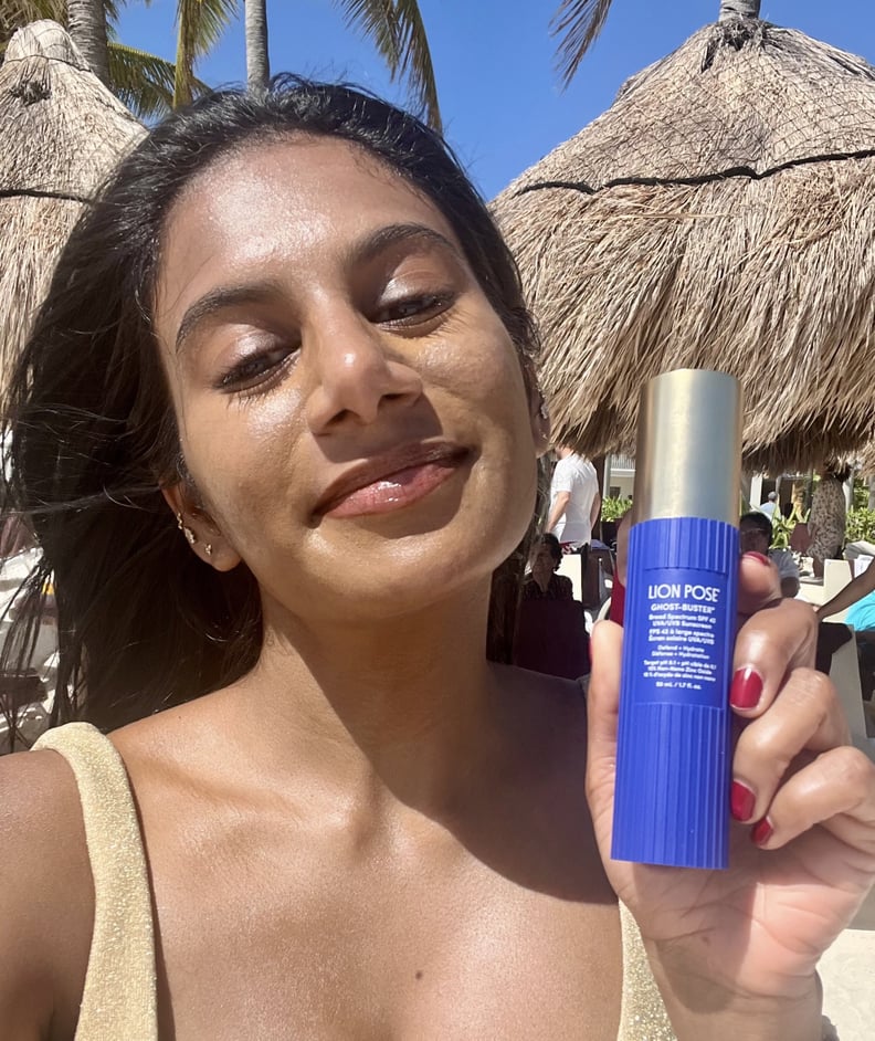 Woman wearing the Lion Pose Ghost-Buster Mineral Sunscreen SPF 42 on a beach.