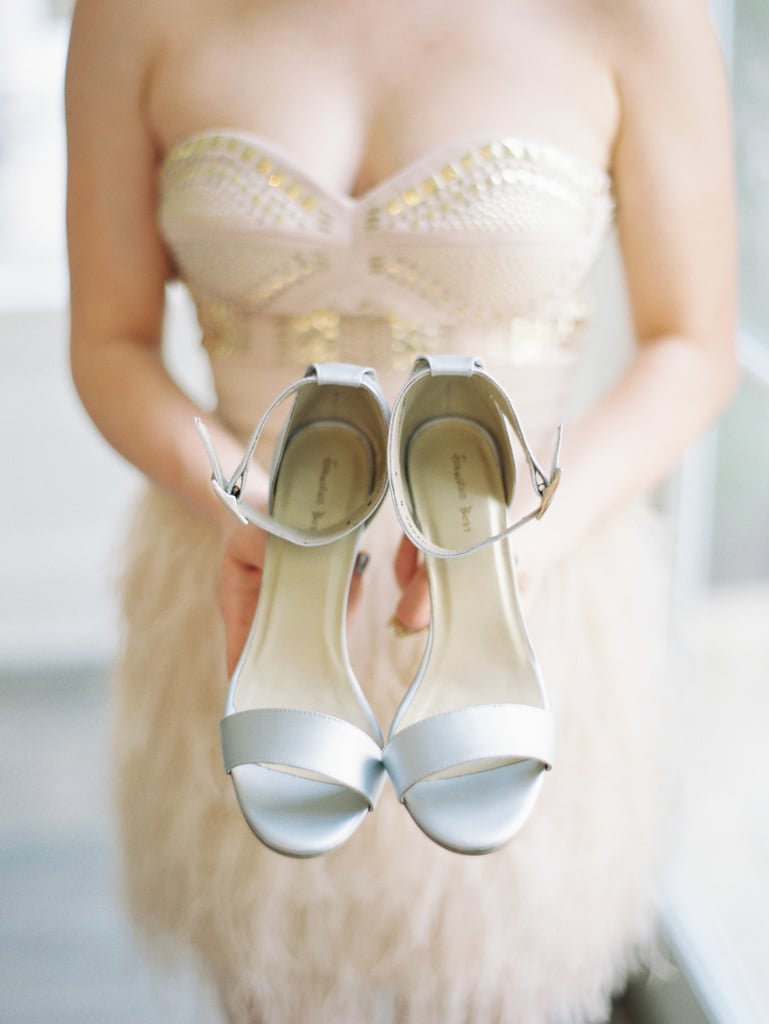 8. Bride Holding Shoes