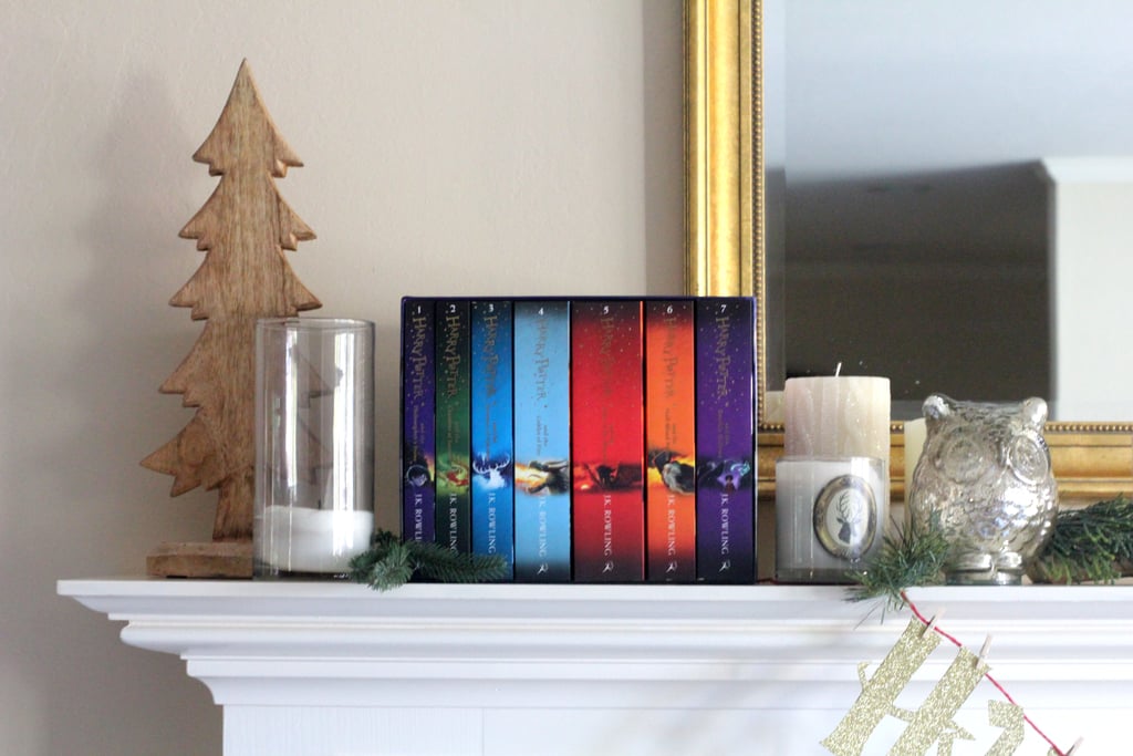 Decorate your mantel with Harry Potter books, candles, and owls.
