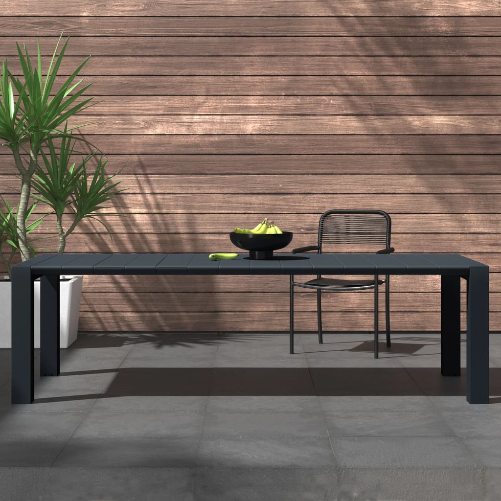 An Outdoor Dining Table: Wade Logan Martinson Plastic/Resin Dining Table