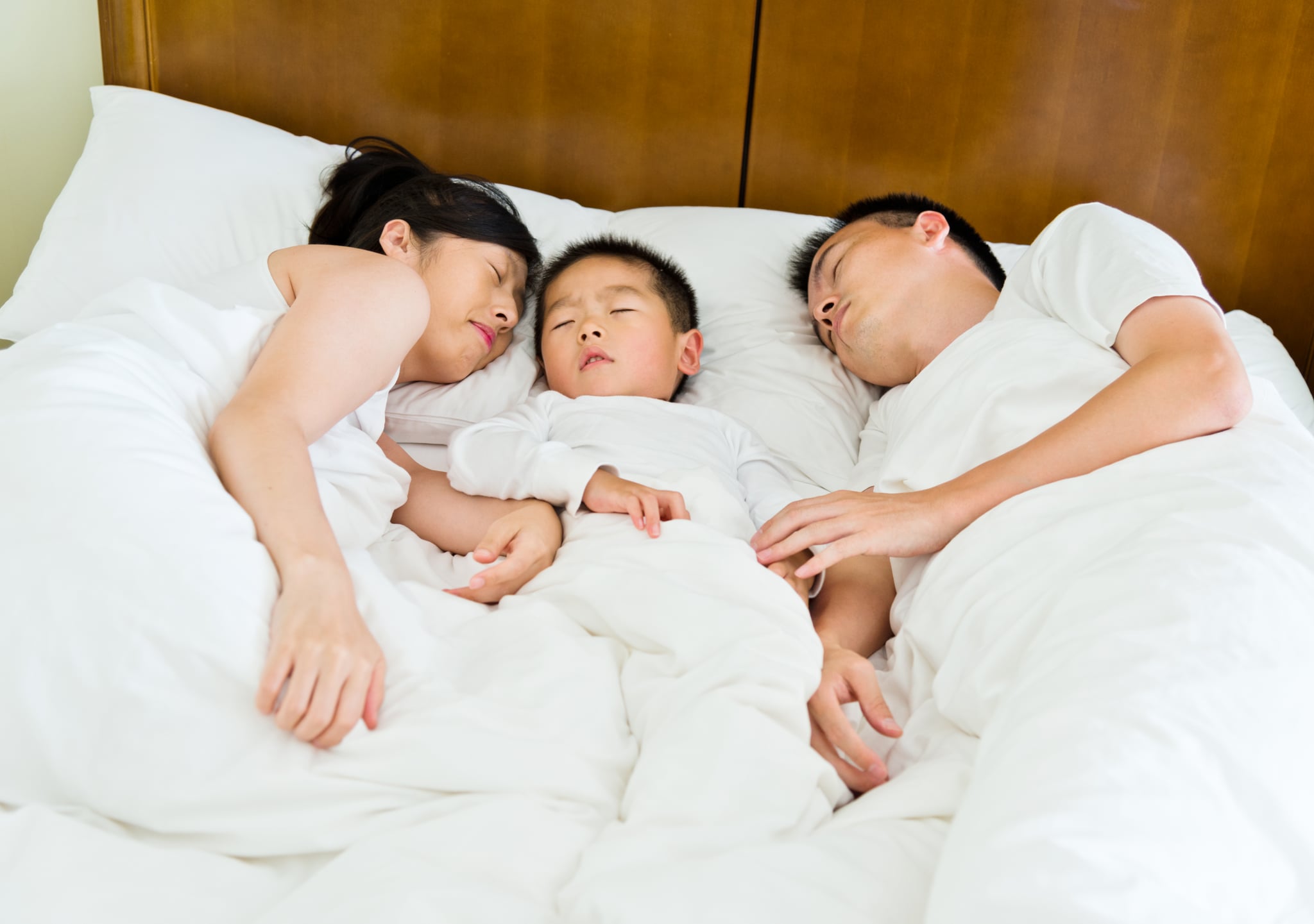 Sleeping family with a little son.