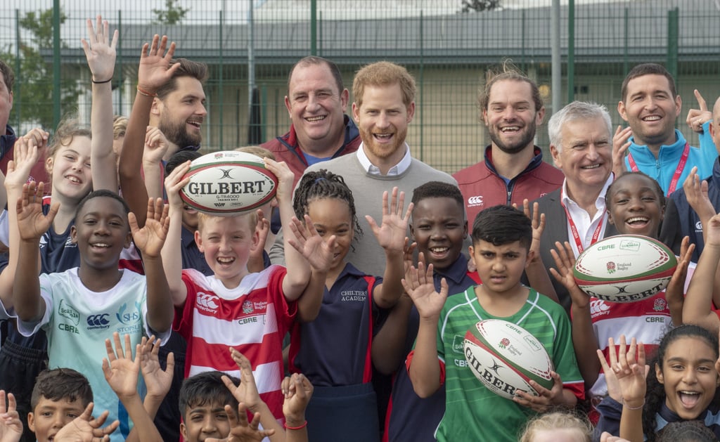 Prince Harry Hugs Kids at Lealands High School