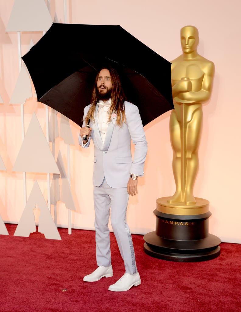 First, He Hit the Red Carpet With a Comically Large Umbrella
