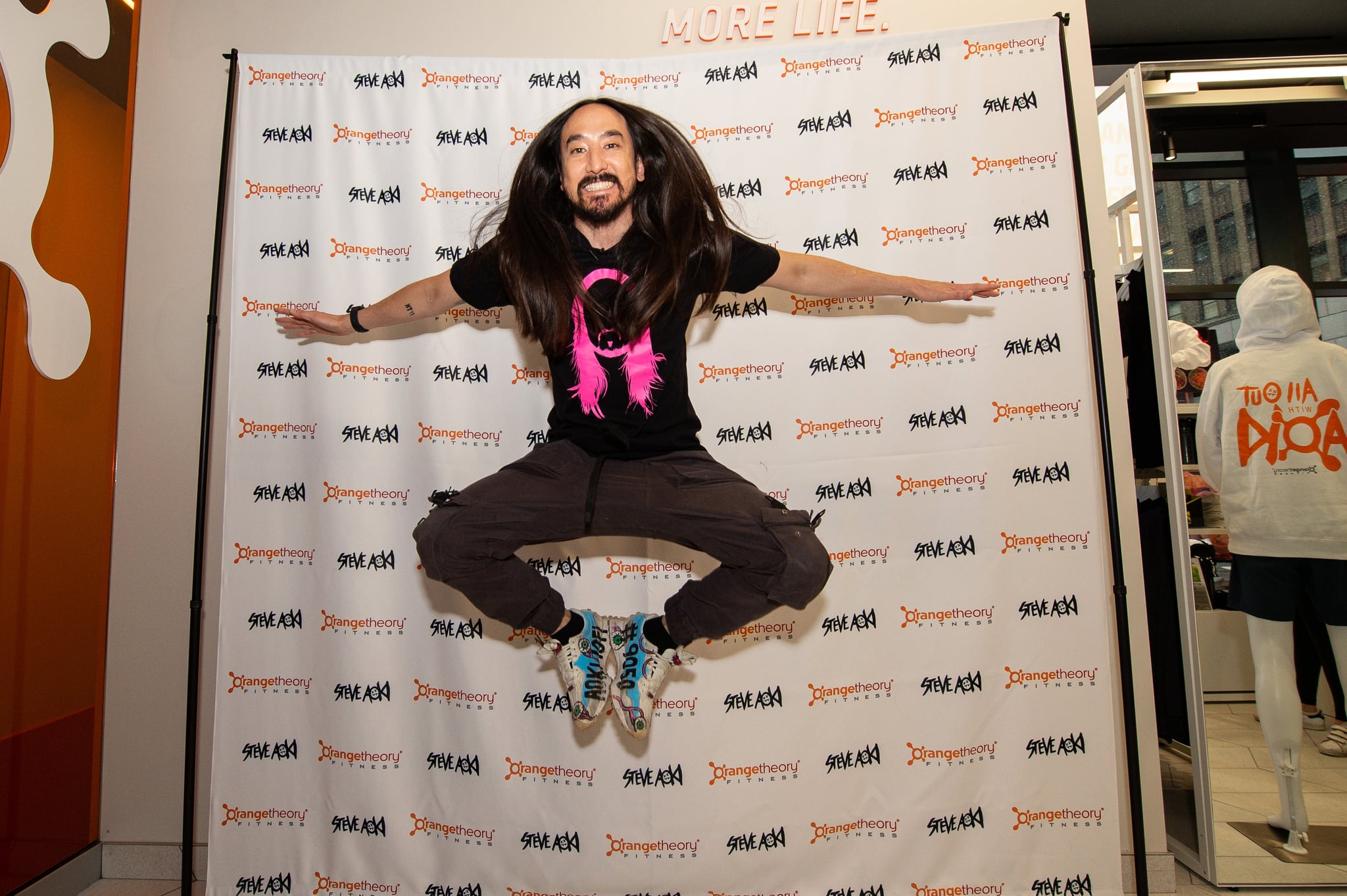 Steve Aoki electrifies the crowd with his signature jump during Orangetheory Fitness' exclusive Chief Music Officer launch event in New York City on Wednesday, March 9, 2022. (Photo by Diane Bondareff/Invision for Orangetheory Fitness/AP Images)