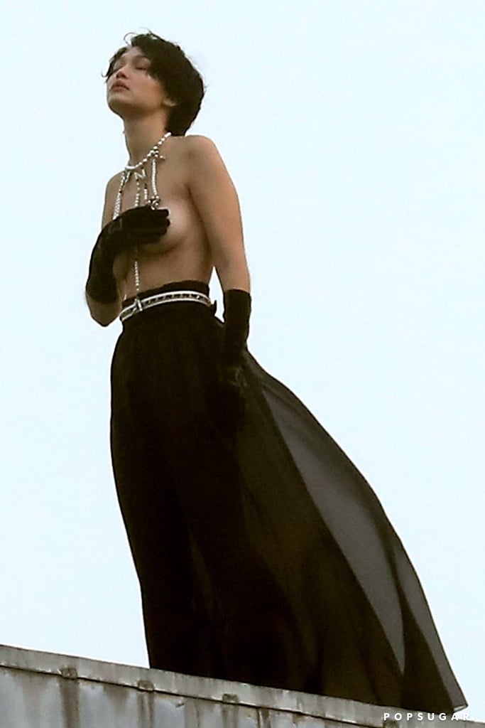Gigi Hadid, is that you? On Tuesday, the 24-year-old model was almost unrecognizable as she posed topless for a Chanel photo shoot in Paris. Clad in a shaggy black wig and black skirt, Gigi — who we almost confused for her sister Bella — was totally in her element as she worked the camera on the roof of the iconic Opera Garnier. We're not entirely sure what the photo shoot was for, but from the looks of it, it's going to be pretty amazing. 
While it may seem like almost everyone has been in Miami for Art Basel (including Bella) this week, Gigi has been busy working in Paris. On Wednesday, the model hit the runway for Chanel's Métiers d'Art 2019/2020 show, which also brought out fellow model Kaia Gerber. See more of Gigi's photo shoot ahead.

    Related:

            
            
                                    
                            

            Please Enjoy These Pictures of the Wildly Attractive Hadid Family