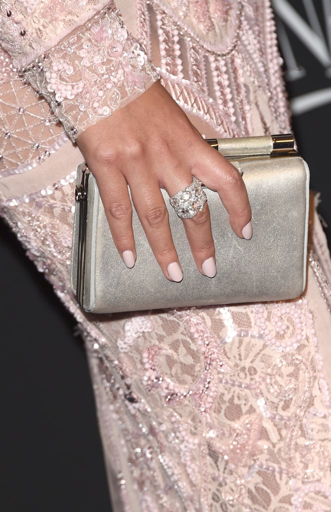 Chrissy Teigen paired a metallic clutch with her Zuhair Murad gown.