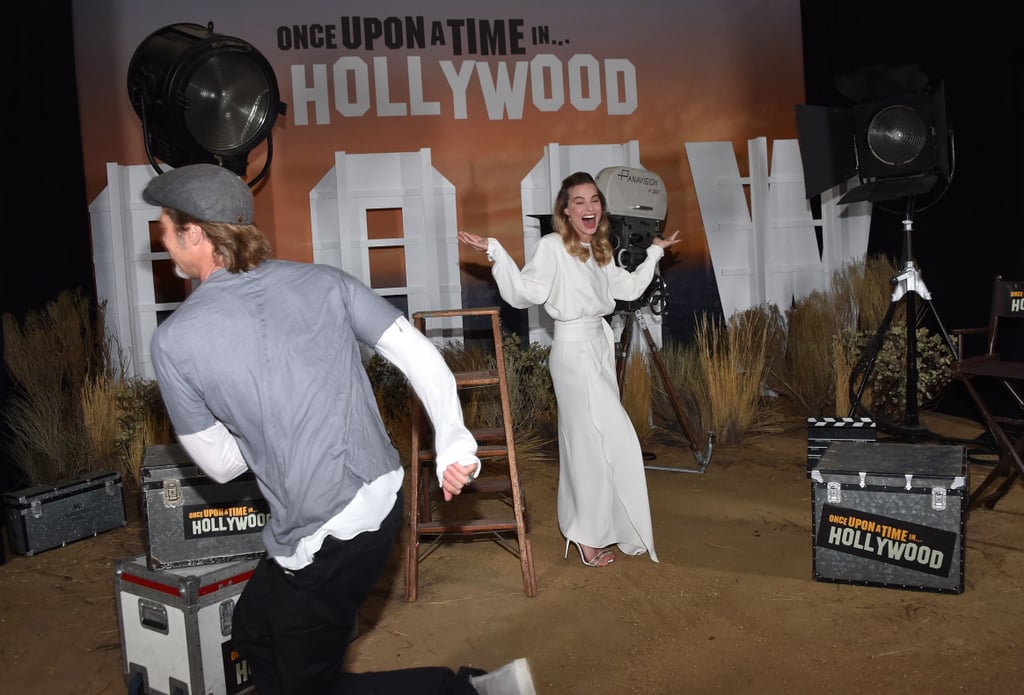 Brad Pitt Photobombing Margot Robbie and Leonardo DiCaprio