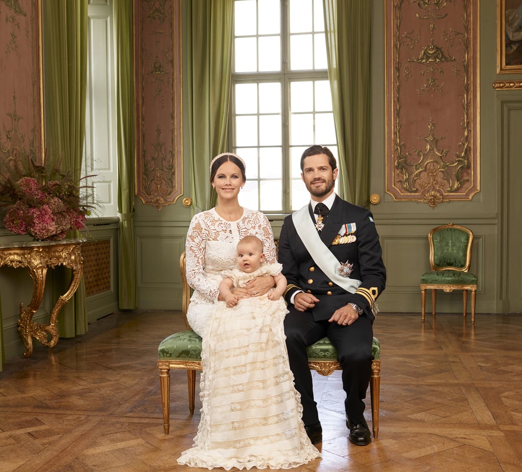 Prince Carl Philip and Princess Sofia of Sweden have one adorable son, Prince Alexander, and his cuteness was on full display during his christening at the Palace Chapel in Drottningholm Palace in Stockholm on Sept. 9. The 5-month-old prince, who Carl and Sofia welcomed in April, looked as happy as can be while being held by his mom during the ceremony. Crown Princess Victoria and Prince Daniel also made an appearance with their children, Princess Estelle and Prince Oscar, the latter of whom broke into a huge smile when he laid eyes on his cousin. 
On Monday, Sweden's Royal Palace released adorable new photos of the family of three posing with Sofia's sisters, Lina and Sara Hellqvist, and Carl's sisters, Crown Princess Victoria and Princess Madeleine. Another portrait shows the trio with both sets of Alexander's grandparents, Carl XVI Gustaf, Queen Silvia, and Erik and Marie Hellqvist. Prince Carl and Princess Sofia have been sharing a whole bunch of aww-inducing photos of Alexander since his birth, but his christening photos might take the cake (those cheeks!).
