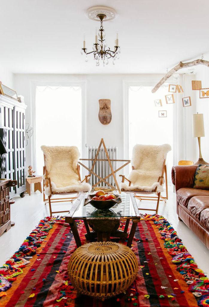 Sheepskin chairs pair perfectly with this large, colorful rug — Pocahontas would note that it contains all the colors of a warm sunset.