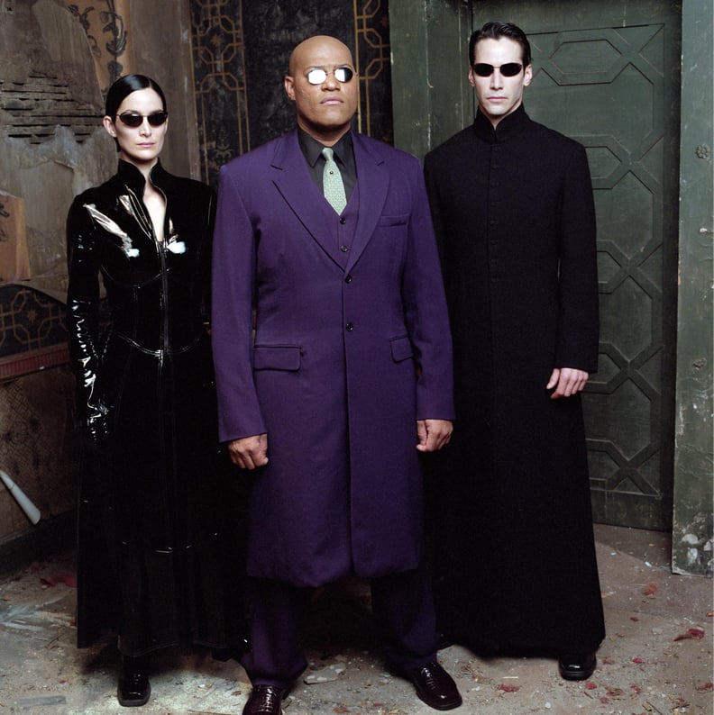 THE MATRIX REVOLUTIONS, from left: Carrie-Anne Moss, Laurence Fishburne, Keanu Reeves, 2003.  Warner Bros. / courtesy Everett Collection