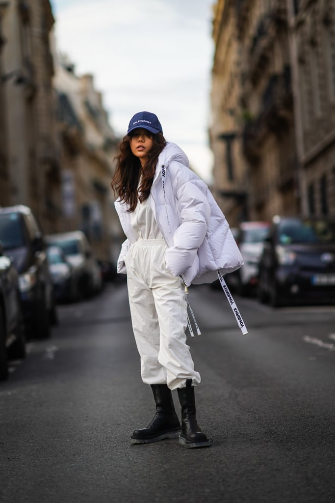Go monochrome with your athleisure outfit and ground the look with contrast boots and a baseball cap.