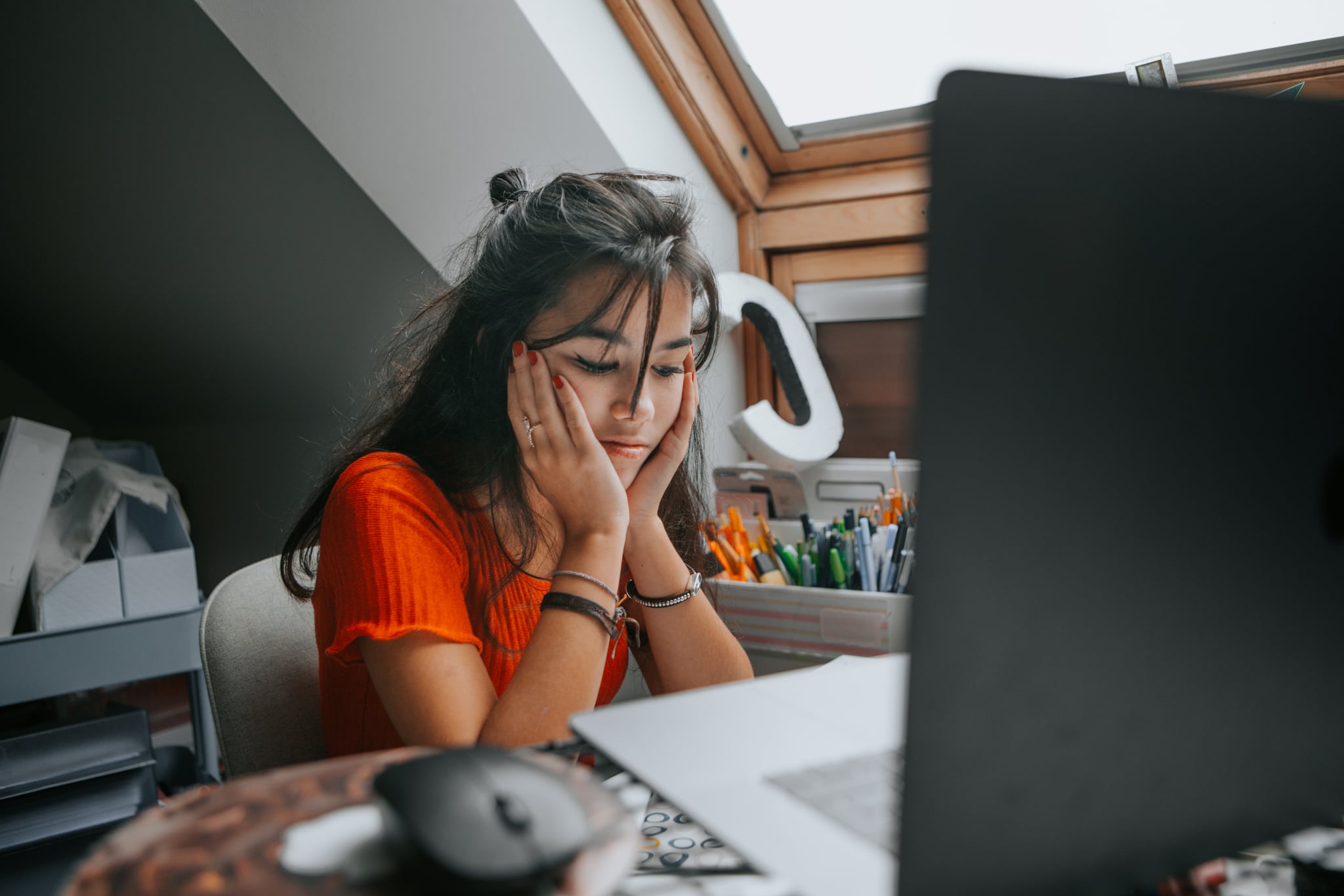 female teenager feeling stressed studing at home.E learning.Home schooling