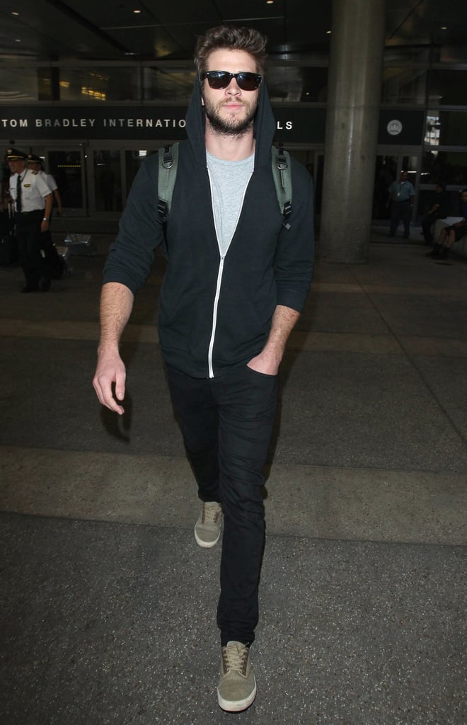 Liam Hemsworth touched down at LAX on Friday.