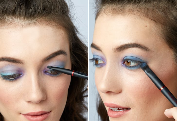 Step 2: Layer on purple and navy eye shadow for more impact