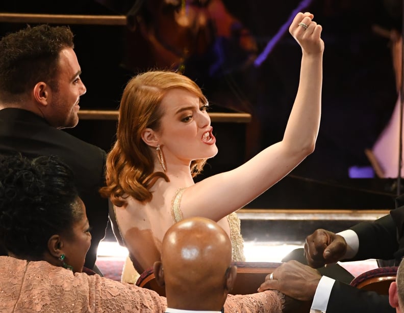 Emma Stone either busted out a dance move or really wanted someone to pass her a snack.