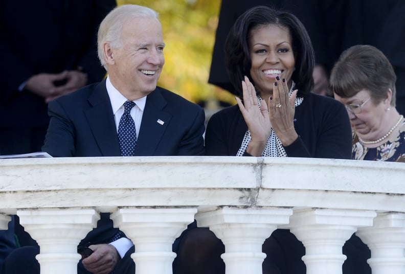 ARLINGTON, VA - NOVEMBER 11: US Vice President Joe Biden (L) and First Lady Michelle Obama (R) attend a ceremony on Veteran's Day at the Tomb of the Unknown Soldier in Arlington National Cemetery on November 11, 2012 in Arlington, Virginia. (Photo by Mich