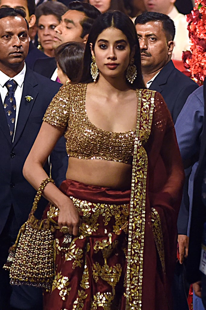 Bollywood Actress Janhvi Kapoor Wore a Red and Gold Abu Jani Sandeep Khosla Lehenga
