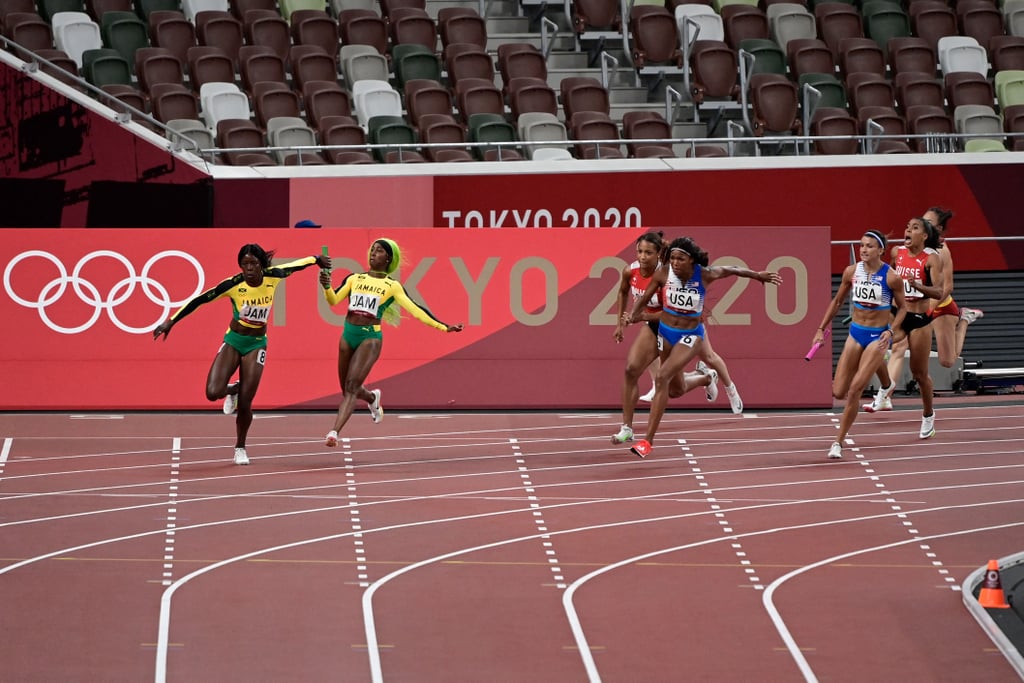 Teams complete the final baton hand-off in the women's 4x100m relay final at the 2021 Olympics.