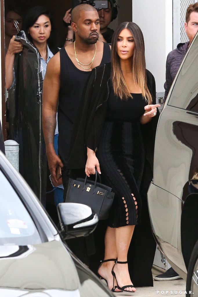 Kim toted her black Hermès bag and finished her outfit with a statement ring and tall sandals.