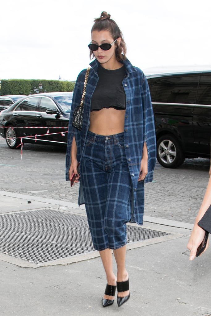 Bella Wore Blue Plaid Trousers, a Matching Cape Jacket, and a Black Crop Top With Her Bra Peeking Out From Underneath