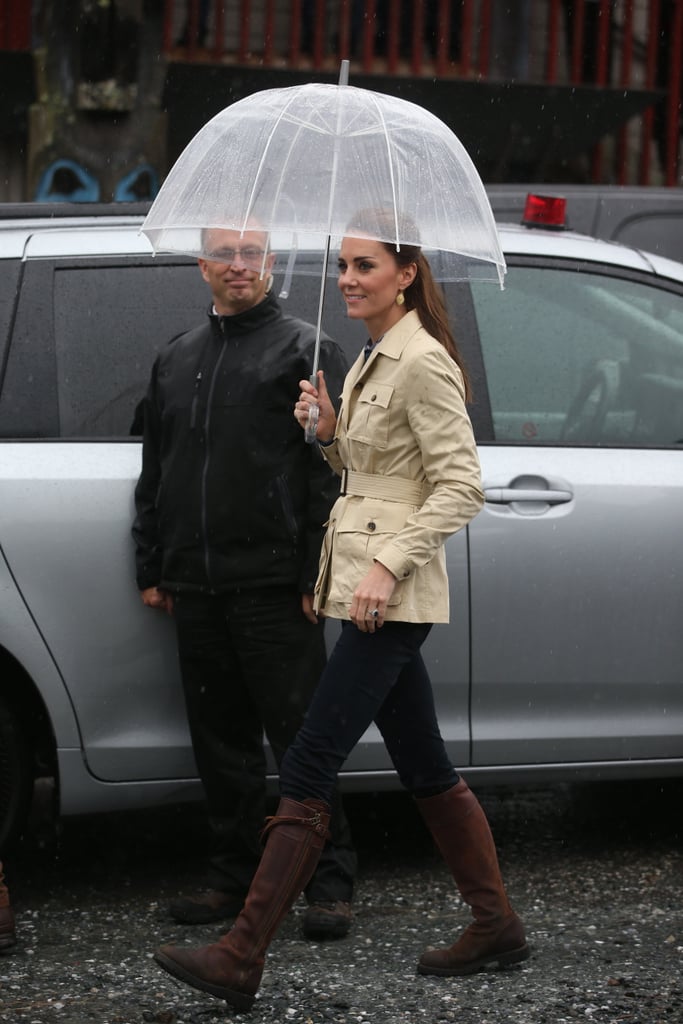 For an official welcome performance from the first nations community members, Kate kept it classic in a belted filed jacket and knee-high boots.  
