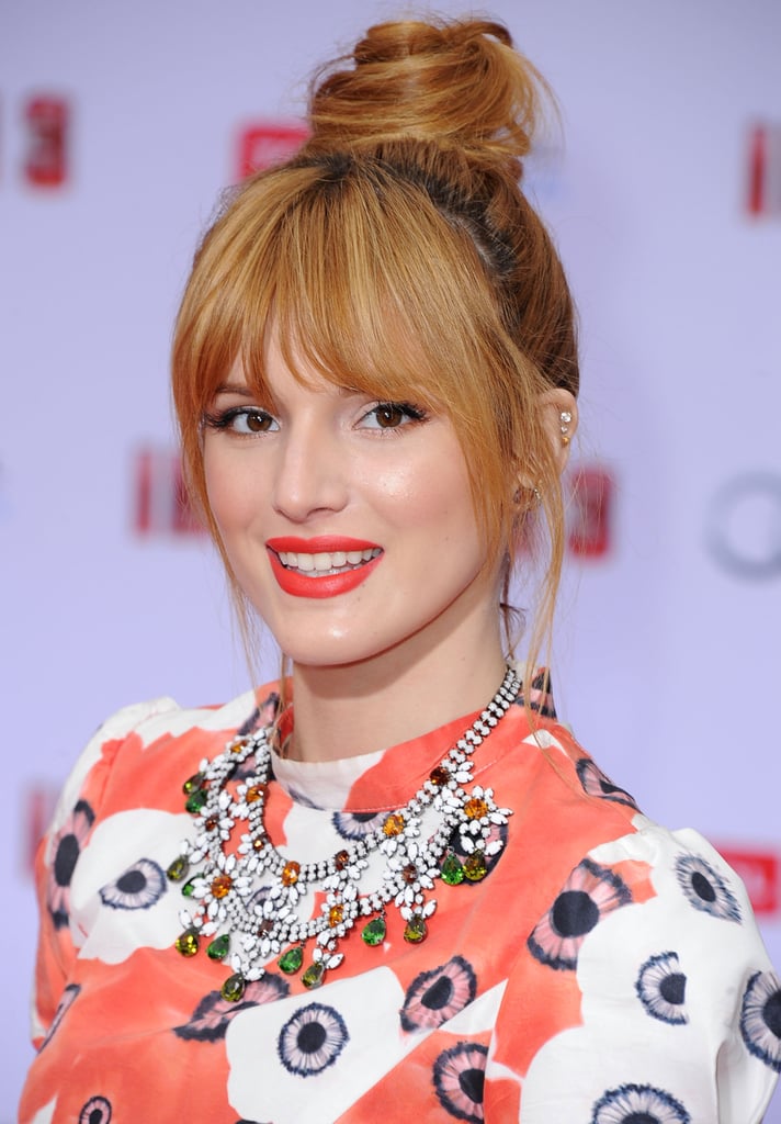 A fiery orange lip hue, just like Bella Thorne's, is the ideal complement to a twisted topknot. Both make a statement and are right on trend for Summer 2013.