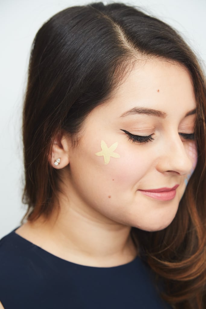 To give my costume even more underwater accents, I cut out the starfish stencil and put it on my cheekbone.