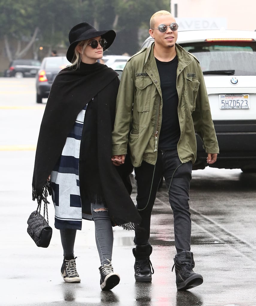 Ashlee Simpson covered up her baby bump for a stroll with Evan Ross in LA on Saturday.