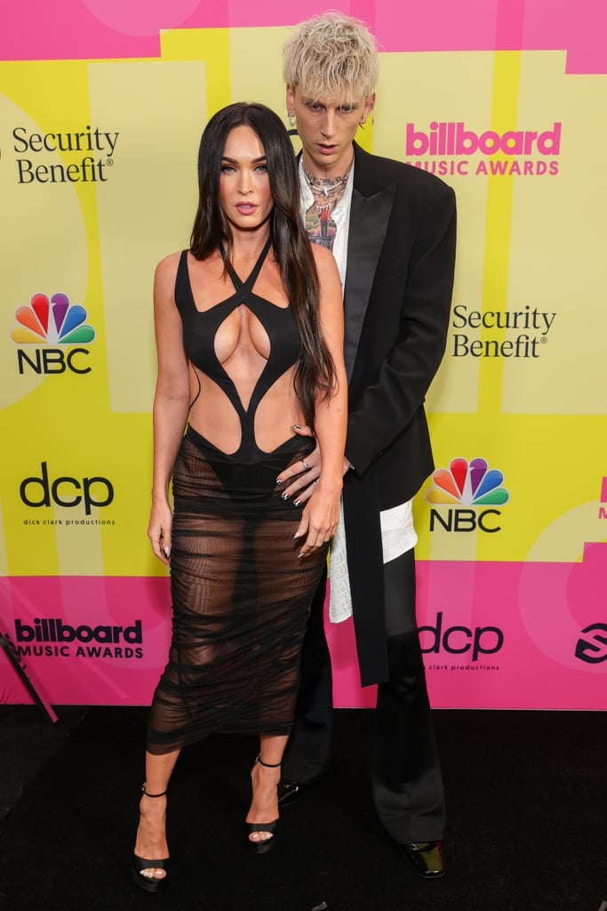 MGK's black Balmain suit was the perfect companion to Megan's show-stopping Mugler moment.