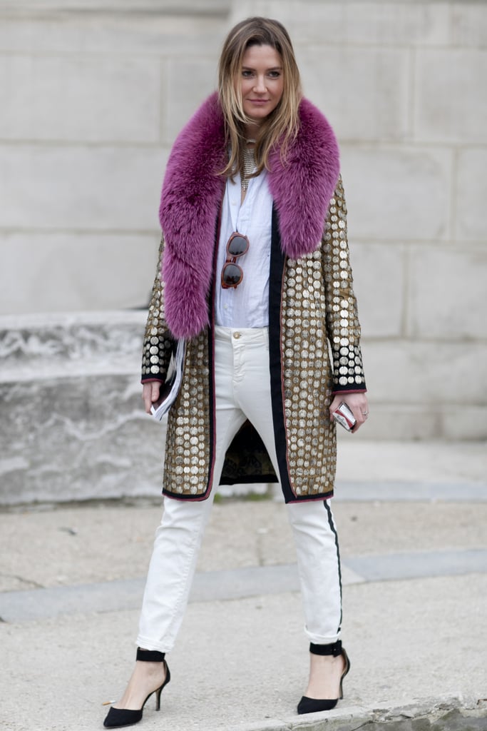 Understated layers got a glamorous counterpart in this showgoer's fur-collared, metallic coat.
Understated layers got a glamorous counterpart in this showgoer's fur-collared, metallic coat.