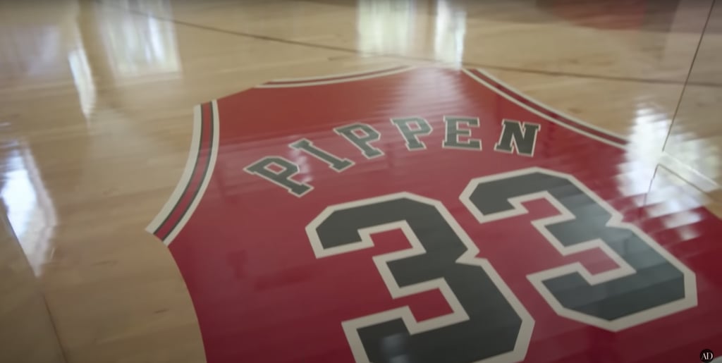Pippen's indoor basketball court includes a huge painting of his Bulls jersey and number on the floor as you enter.