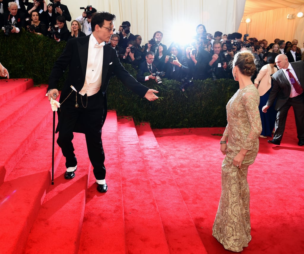 Johnny Depp lent a hand to Amber Heard as they headed up the stairs.