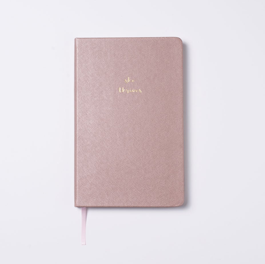 Perhaps your mom needs a place to jot down all of her many thoughts. 
Whitby Rose Gold Journal ($27)