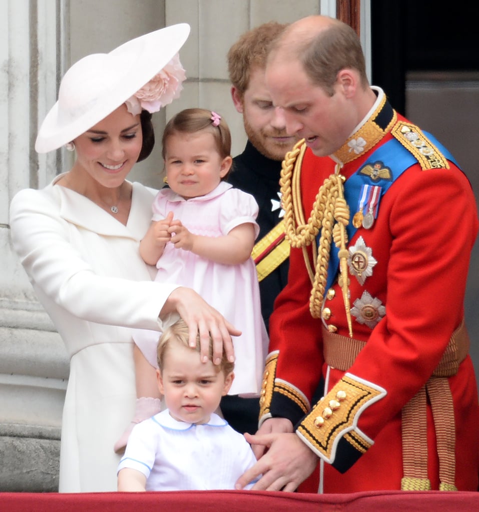While Prince William fussed with George, Kate put a hand on his head and smiled at her son.
