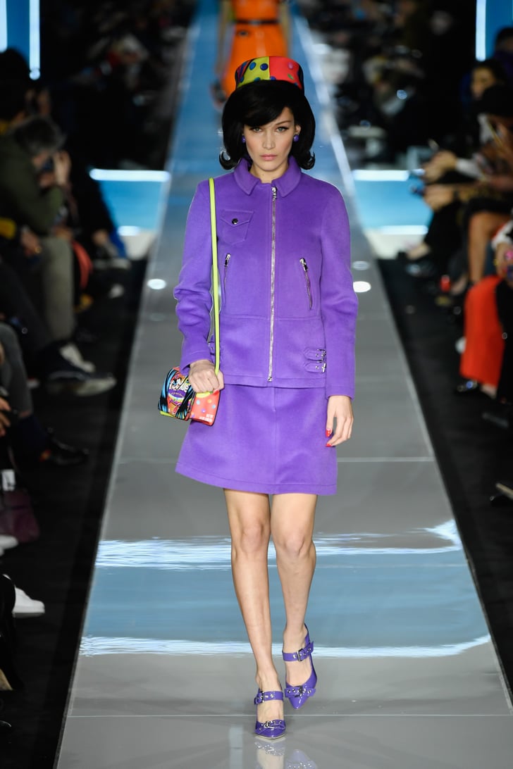 purple outfit and colorful pillbox hat 
