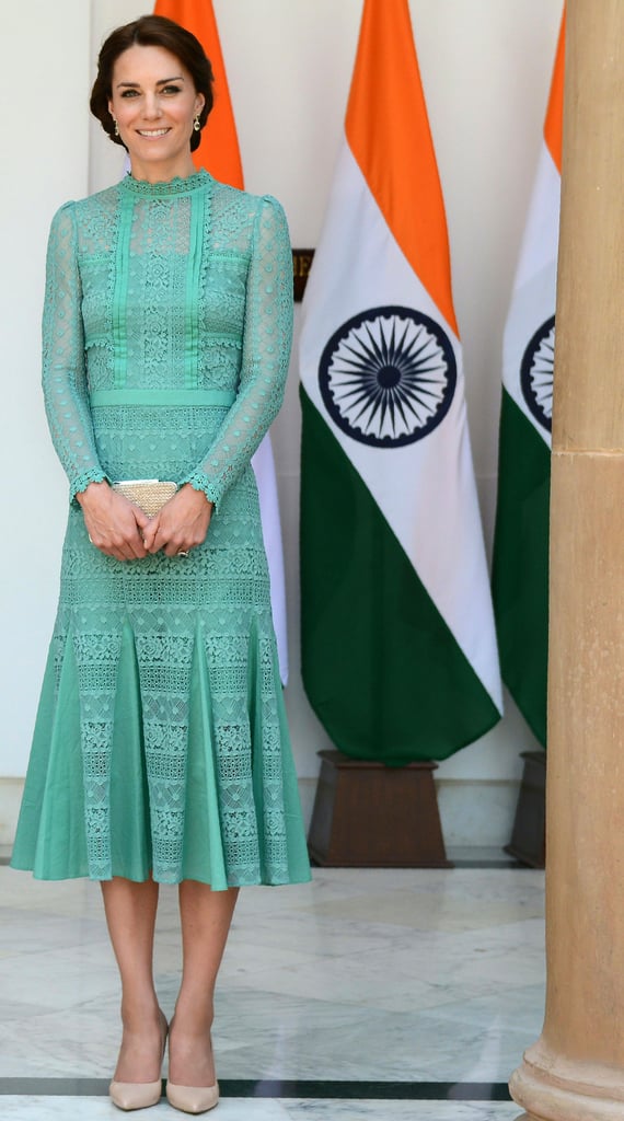 Kate Middleton's very fashionable royal tour of India continued Tuesday as she and her husband, Prince William, paid a visit to the country's prime minister, Narendra Modi. Over lunch and a photo op, Kate made another sartorial choice that paid homage to Britain; she wore a jade-green dress designed by Alice Temperley.
The green dress was, of course, Kate's second outing in Temperley since arriving in India over the weekend. On Monday, Kate wore a two-piece Temperley set for a special gala held in honor of Queen Elizabeth's 90th birthday.
Because the color of Kate's dress was so vibrant, she left the rest of her outfit slightly understated. Both her heels and clutch were a beige color, and she wore a two-toned pair of gemstone drop earrings. This was the latest stunning outfit from the duchess on her royal tour — make sure to check out all of Kate's fashion highlights from abroad!