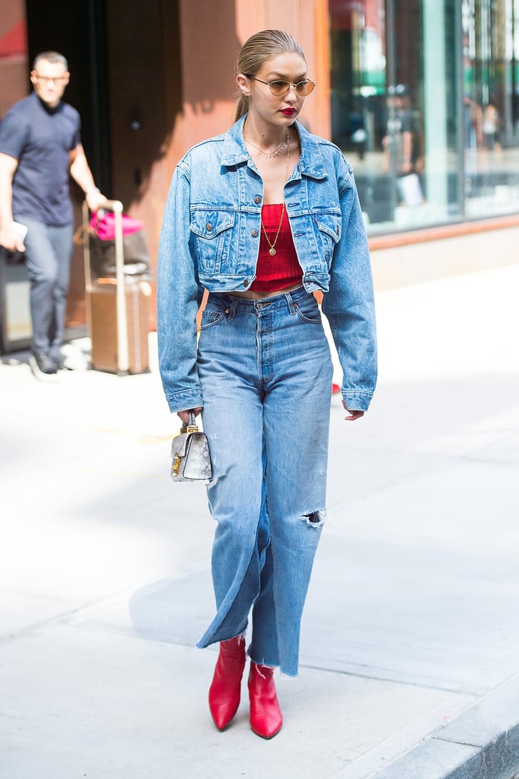 Gigi borrowed a styling trick from sister Bella when she wore this Re/Done denim-on-denim ensemble. The star carried a silver metallic Stalvey handbag and added pops of red with her crop top and Stuart Weitzman Clingy boots.