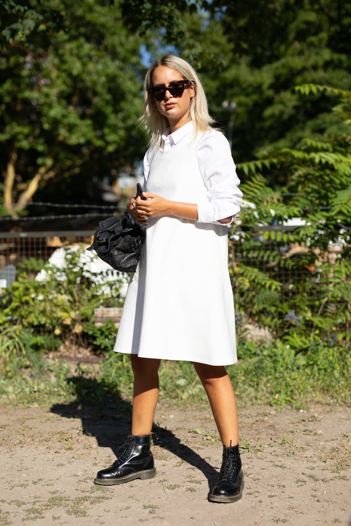 For a cooler day, style a white button-down under your minidress and wear it with black combat boots.