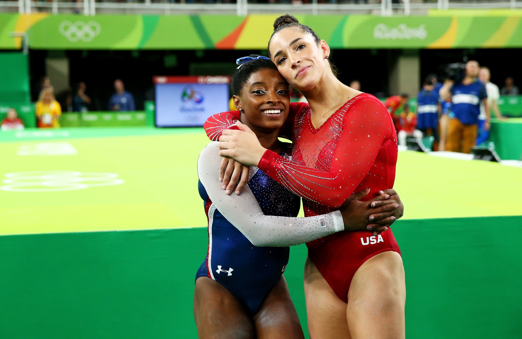 RIO DE JANEIRO, BRAZIL - AUGUST 11:  Simone Biles (L) of the United States waits for the score after competing on the floor with Alexandra Raisman (R) during the Women's Individual All Around Final on Day 6 of the 2016 Rio Olympics at Rio Olympic Arena on August 11, 2016 in Rio de Janeiro, Brazil.  (Photo by Alex Livesey/Getty Images)