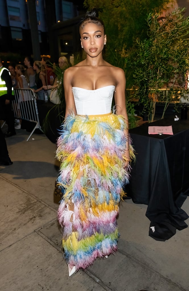 Lori Harvey's Corset Top and Feather Pants at Vogue World
